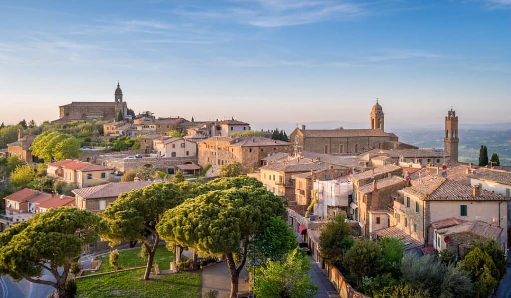 The hilltop town of Montalcino above the Val d'Orcia at golden hour, home of Brunello di Montalcino, Tuscany, Italy